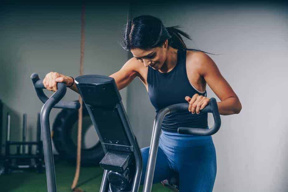 woman exercising on a cross trainer