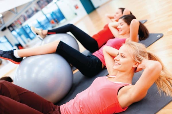 group of women doing an exercise pilates classes