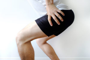 Picture of a man suffering from a hamstring injury or strain