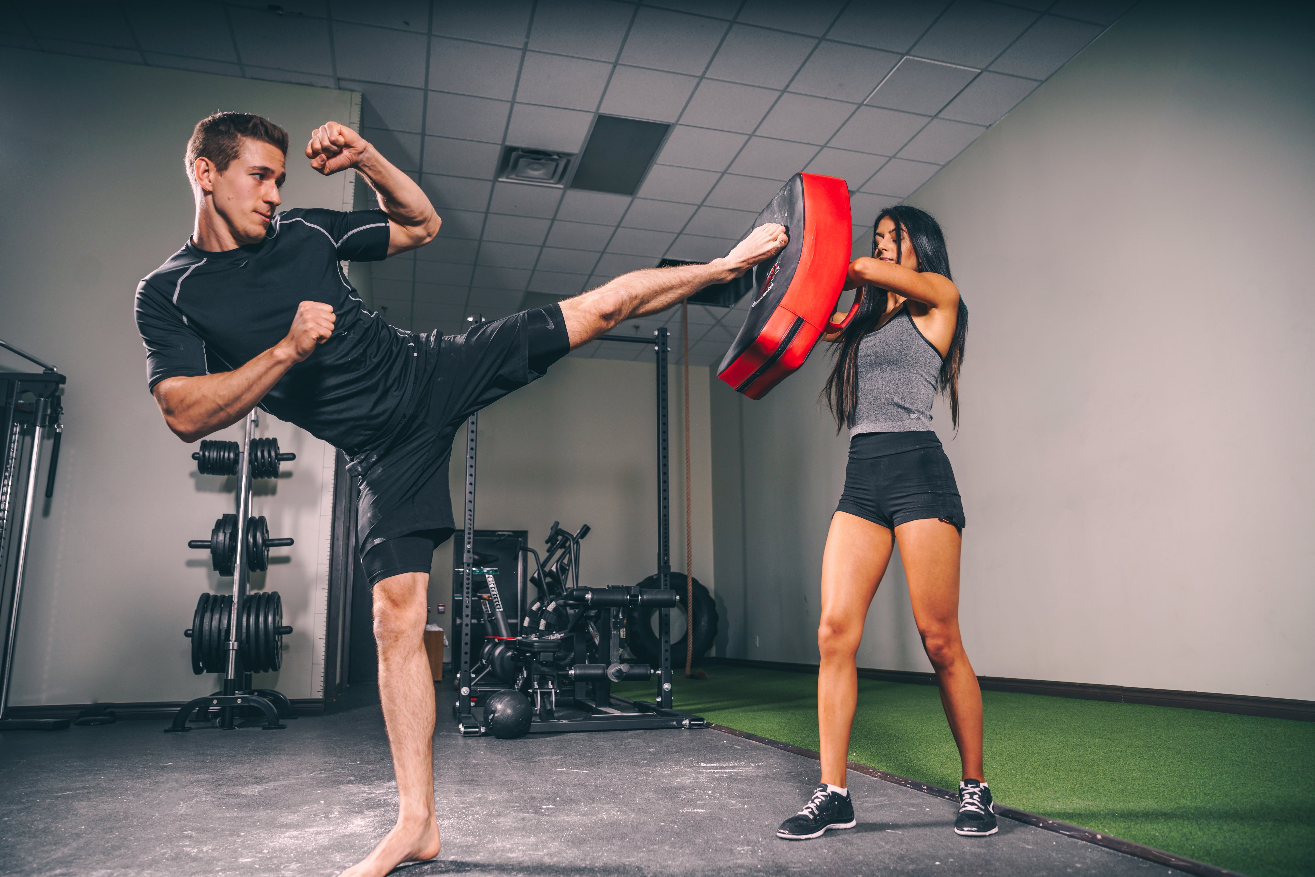 Image of a man doing a kickboxing workout with a partner