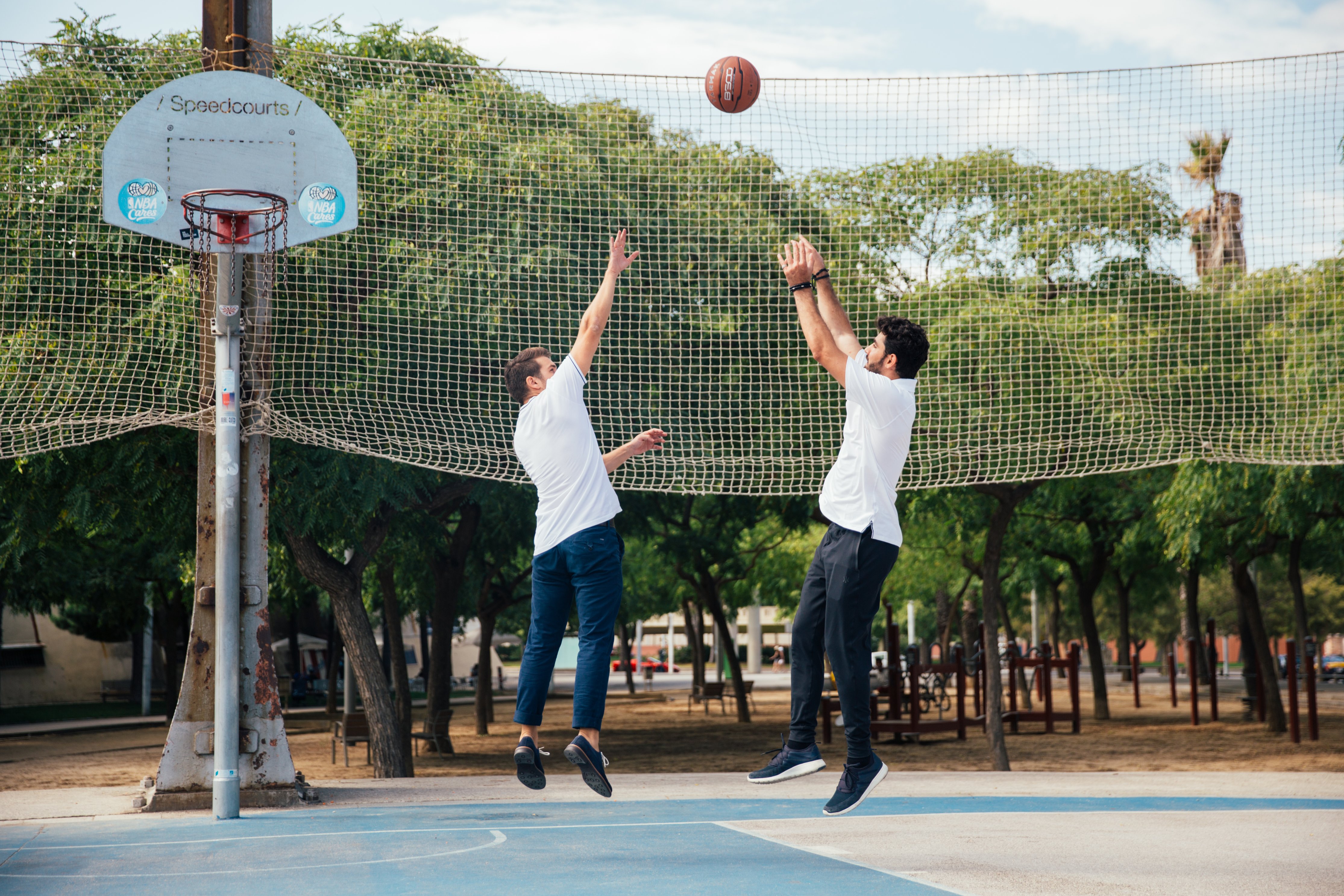 Picture of 2 men playing basketball