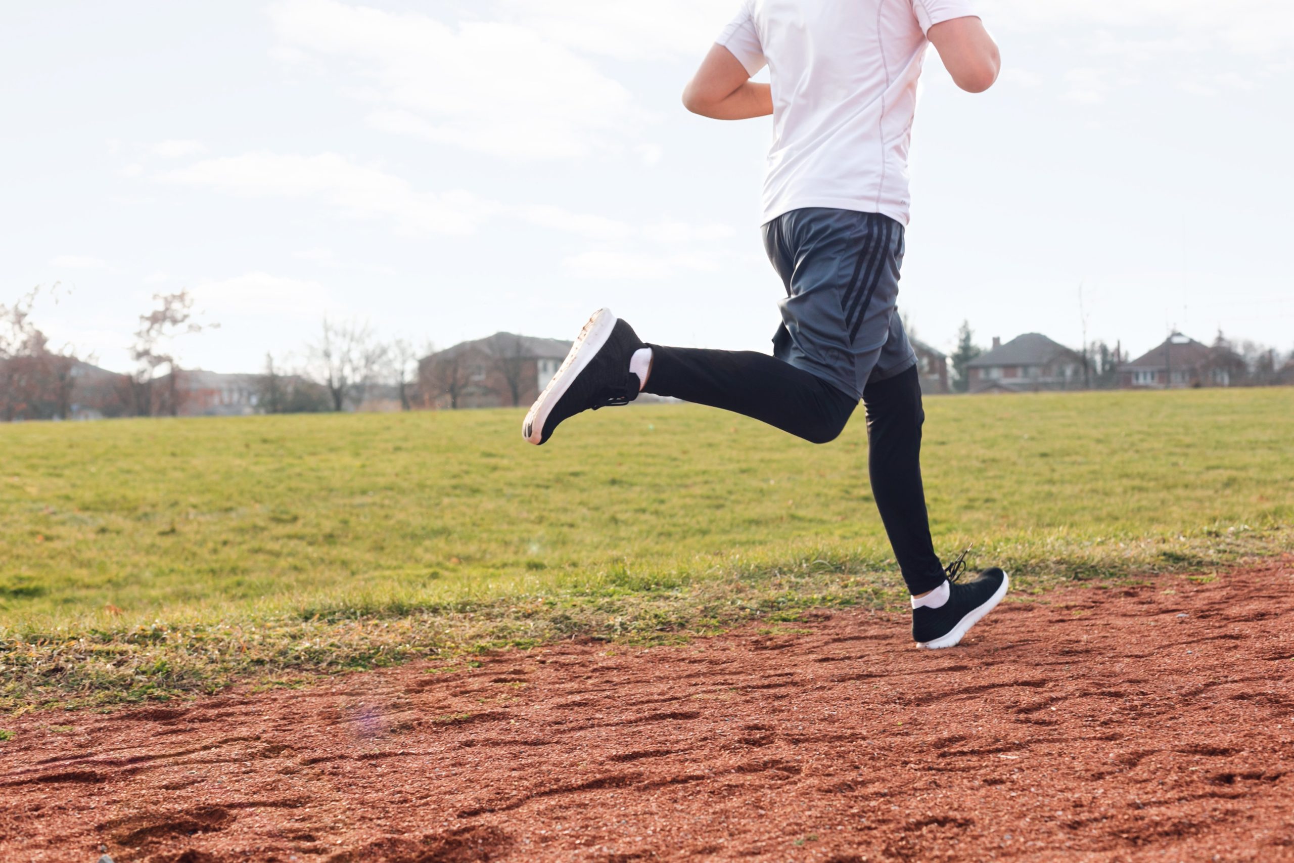 legs running on track