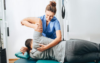 How our physiotherapist can help you with lower back pain treatment 5 woman treating a man