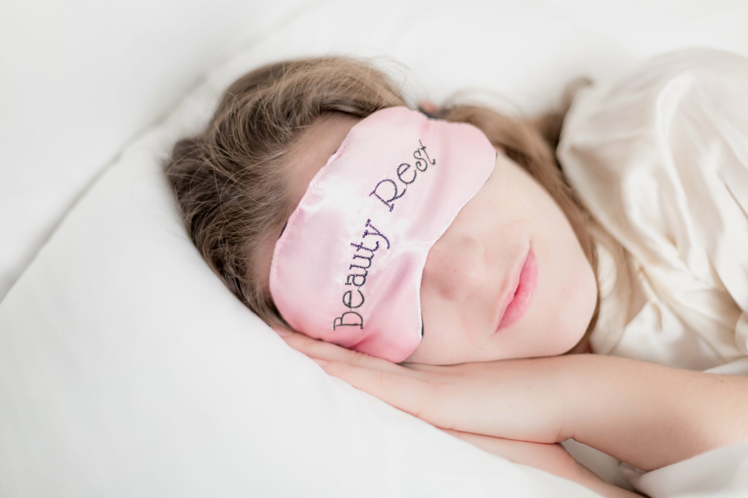woman in beauty rest mask in pillow scaled