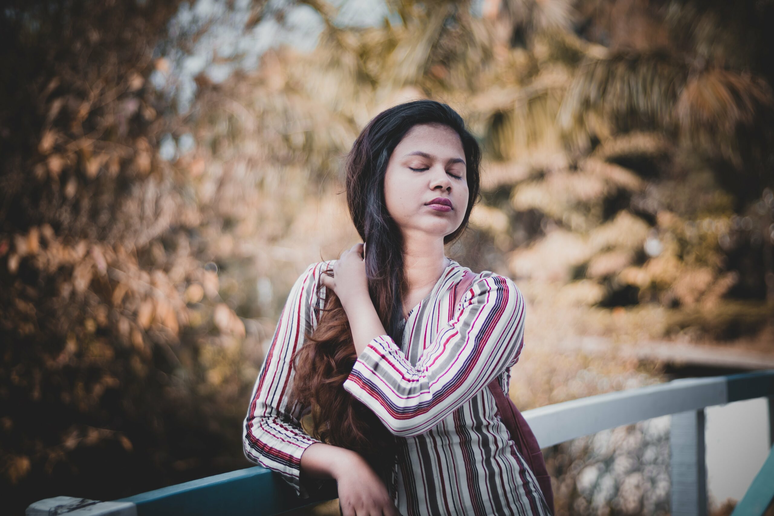 a woman taking in the sound of nature scaled