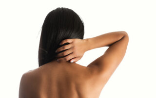 woman hand on back neck