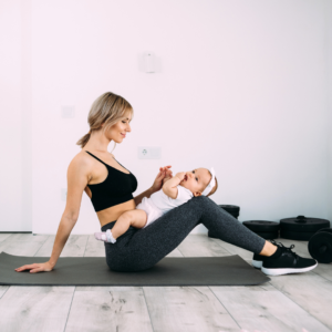 a new mother doing workout with her baby