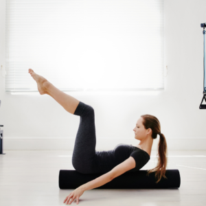 Woman doing pilates core exercise