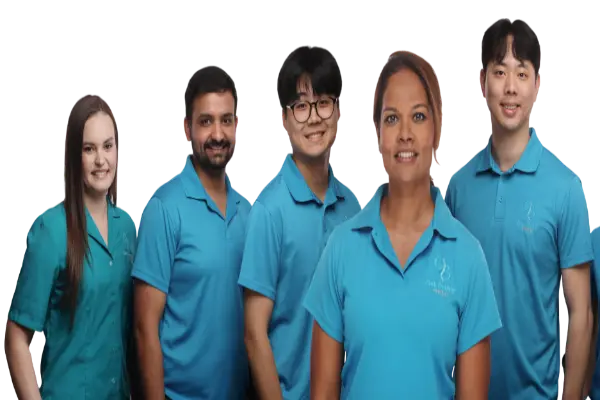 A diverse group of five smiling professional physiotherapists wearing matching teal and turquoise clinical uniforms against a plain white background.