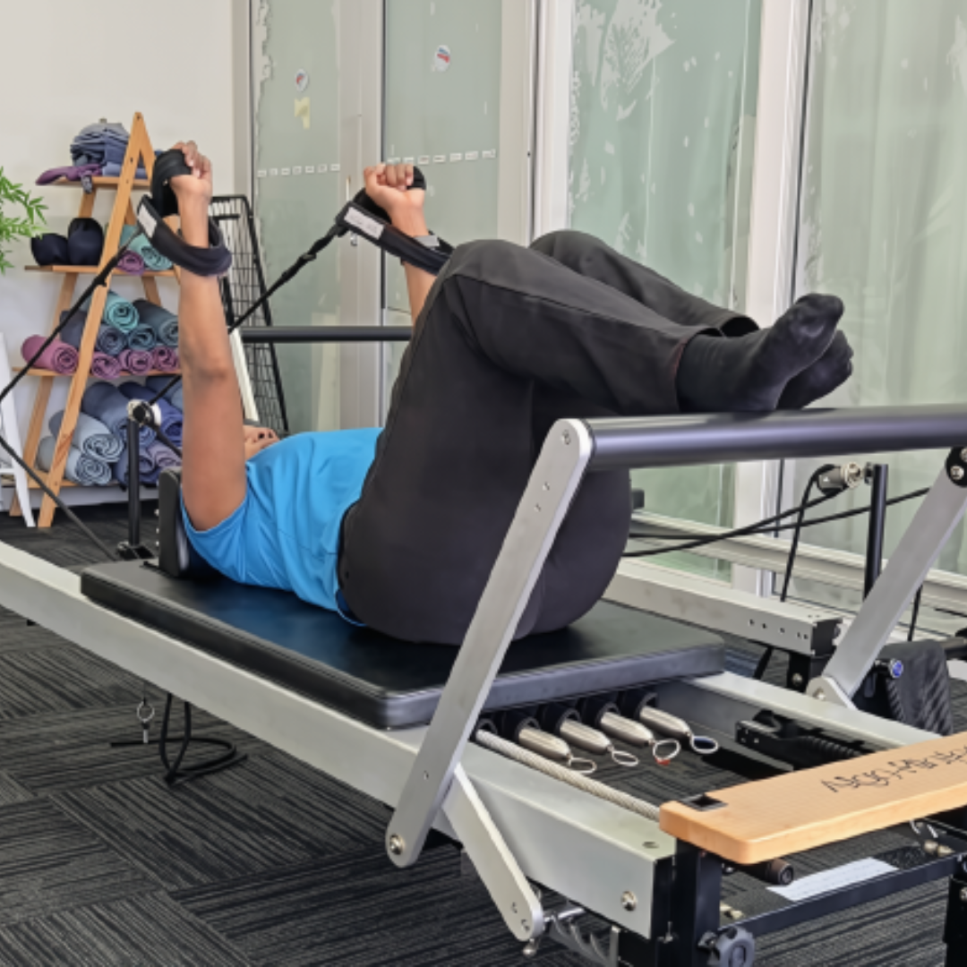Neck Pain Physiotherapy Brisbane South: 8 or 12-Week Plan 7 Woman doing Reformer Pilates exercise