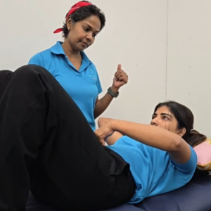 Physiotherapist assessing a postpartum woman's recovery